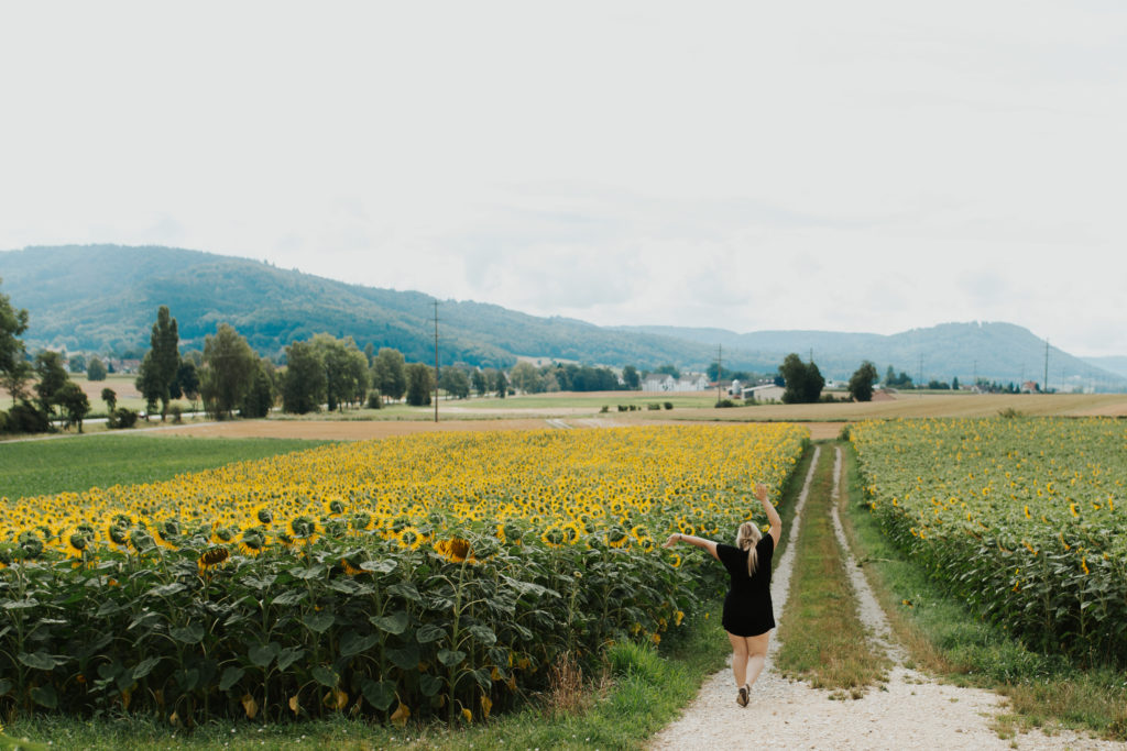 girl walking into a field