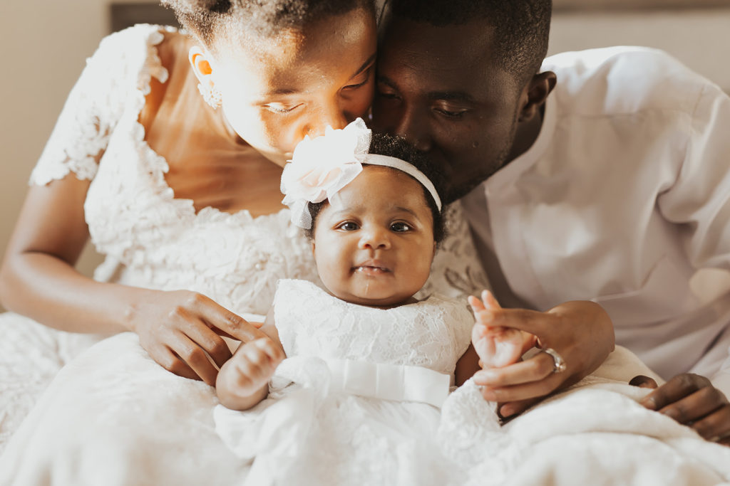 Photos of parents and baby in bed - newborn photos