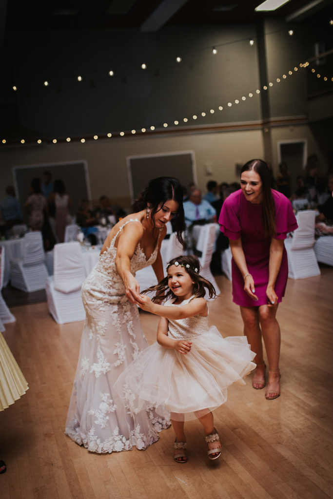 Edmonton wedding bride dancing with flower girl