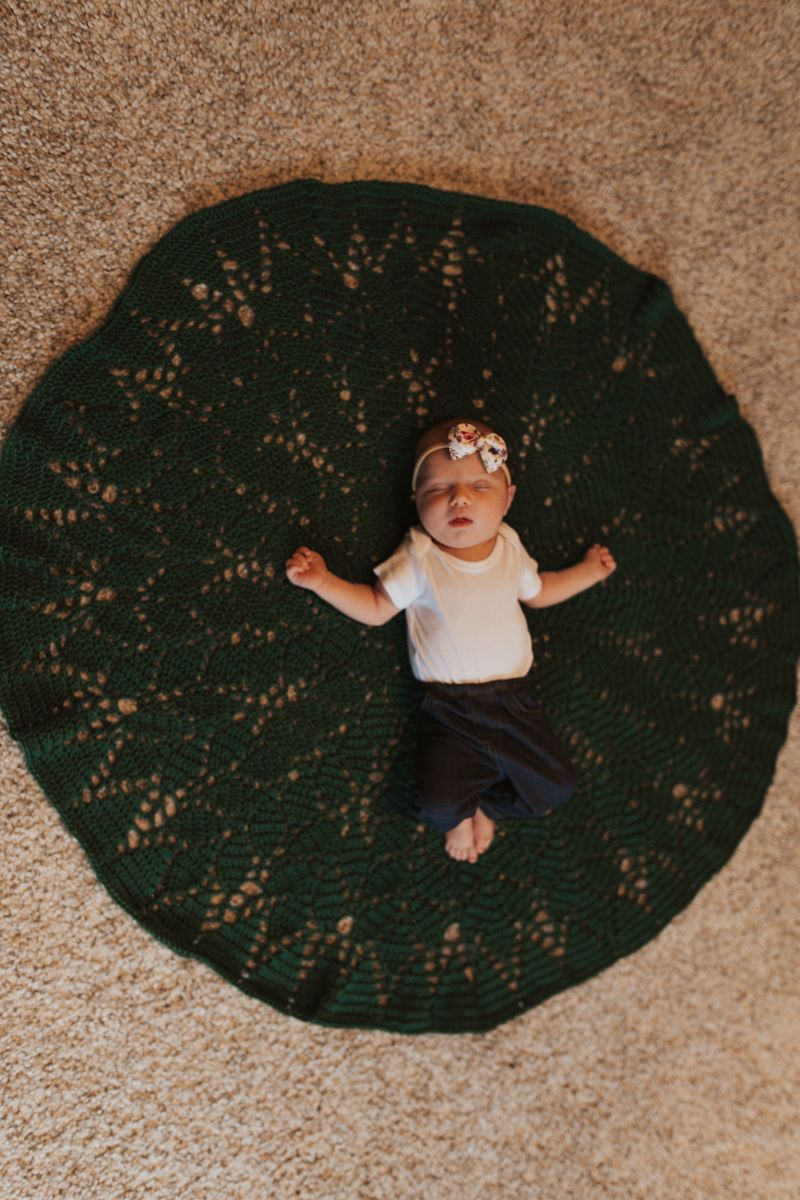 newborn baby pose idea on floor