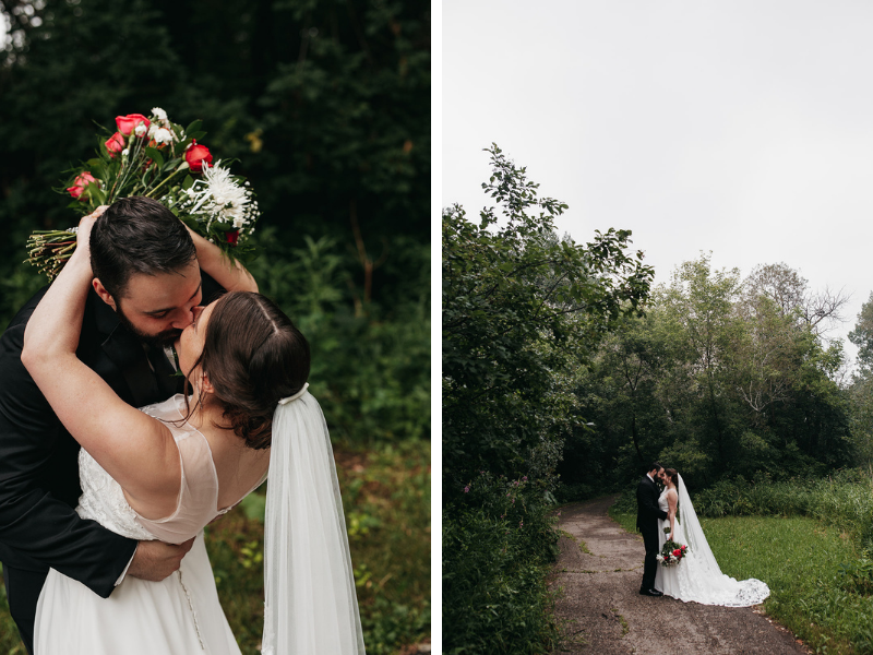 bride and groom kissing during outdoor wedding photos