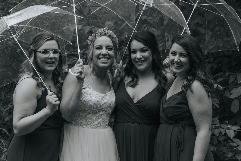 bride and bridesmaid photos in rain